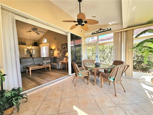 Sunroom with lofted ceiling and ceiling fan