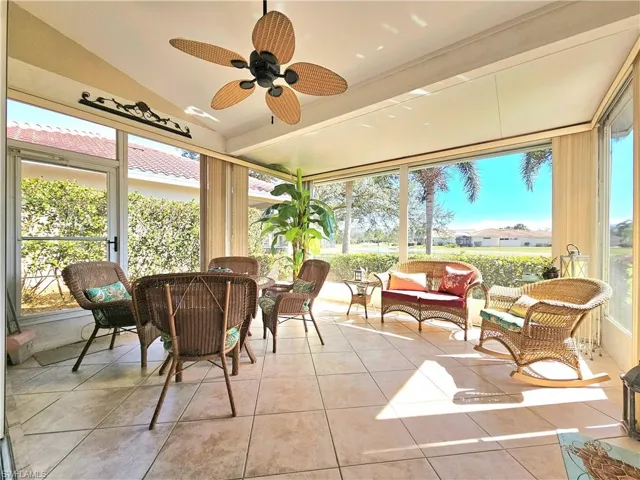 Sunroom / solarium featuring ceiling fan and lofted ceiling
