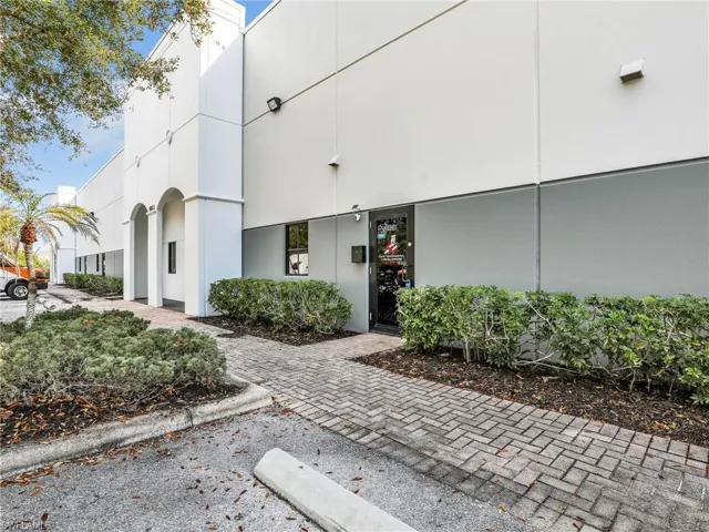 Entrance with five parking spaces and overflow parking for customers