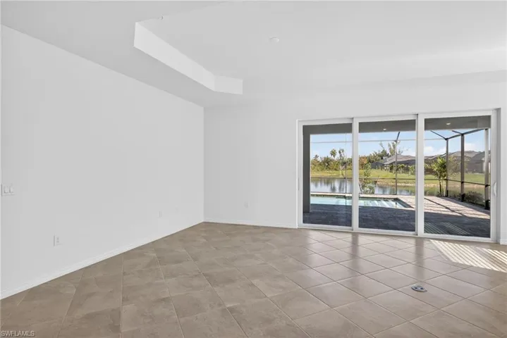 Family Room with baseboards and a water view