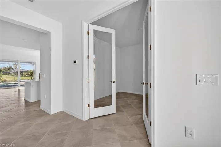 Hallway featuring baseboards