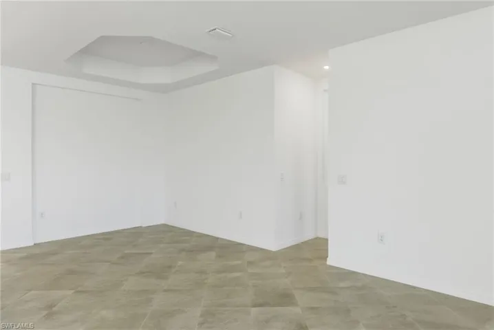 Dining Area featuring a tray ceiling