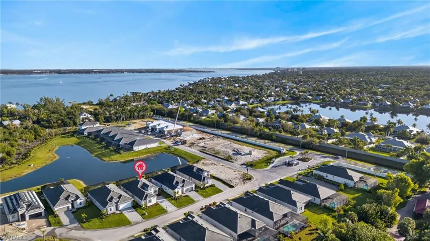 Aerial perspective of suburban area with a large body of water