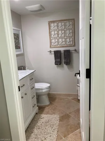 Bathroom with vanity and toilet