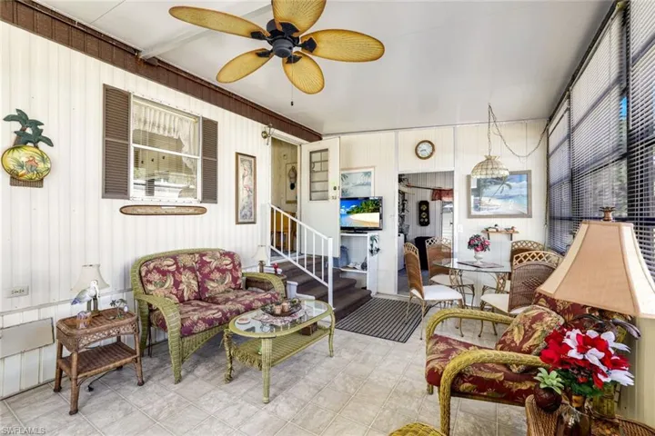Sunroom / solarium featuring ceiling fan and outdoor seating