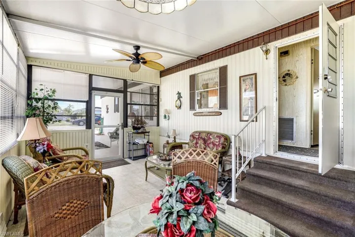 Sunroom / solarium featuring ceiling fan