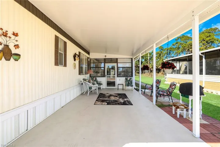 View of patio / terrace with a sunroom