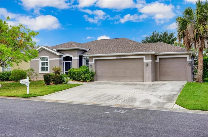 Single-story residence featuring a two-car garage, stucco exterior, and a shingle roof