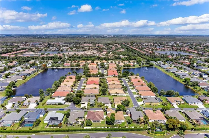 Aerial view of a residential community featuring multiple interconnected bodies of water