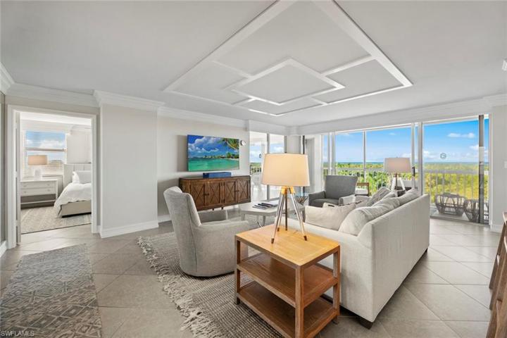 Stylish, comfortable living with endless Gulf Views. New wood ceiling detail, furniture, decor, rugs and paint 2023
