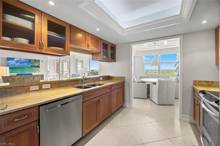 Kitchen features Granite Counters and Stainless Steel Appliances. New paint and stocked kitchen items 2023