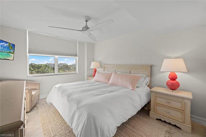 2nd Bedroom features King Size Bed and City Views. New paint, ceiling fan, rug, decor, and bedding 2023