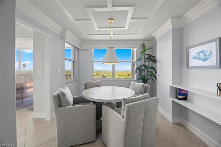 Dining Room (or Den!) has Gulf Views for Sunshine with your meals! Dining Room or Den, this space is versatile enough for either. New ceiling detail, furniture, decor, chandelier and bar shelving 2023