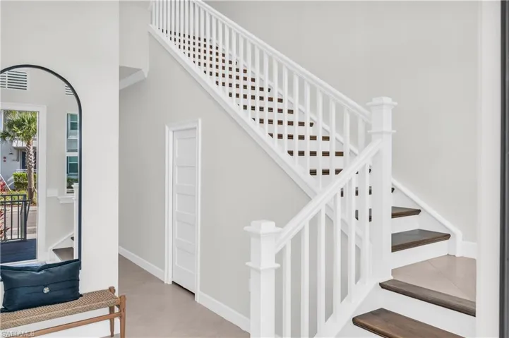 Stairway featuring a high ceiling