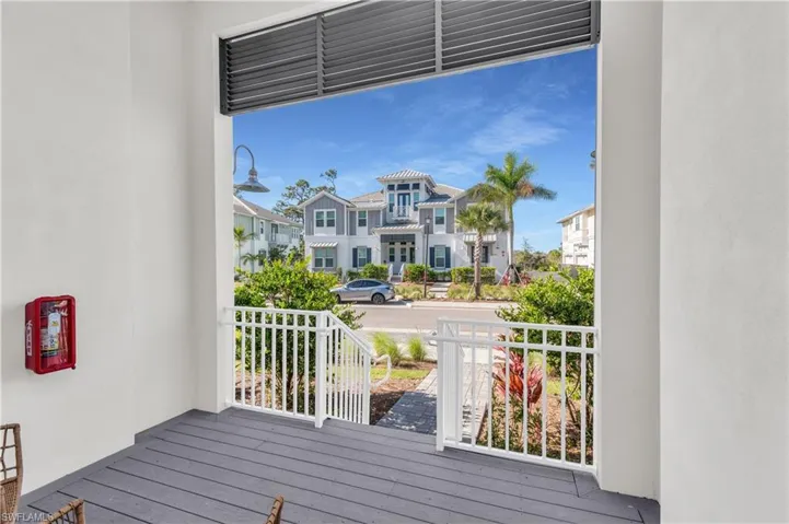 Wooden terrace featuring covered porch