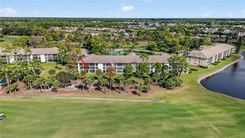 Aerial view of a local golf course and a nearby body of water
