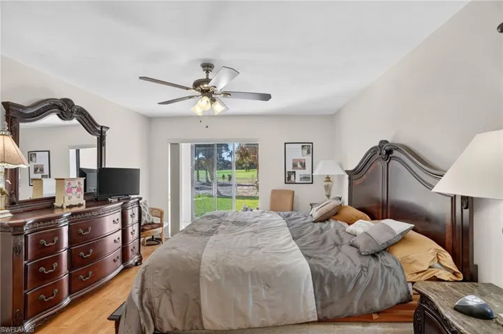 Bedroom with light wood-type flooring and ceiling fan