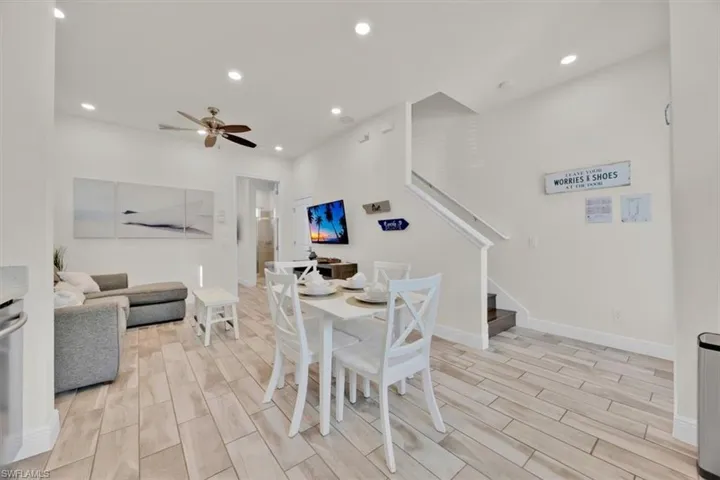Dining space featuring wood tiled floors, recessed lighting, and ceiling fan