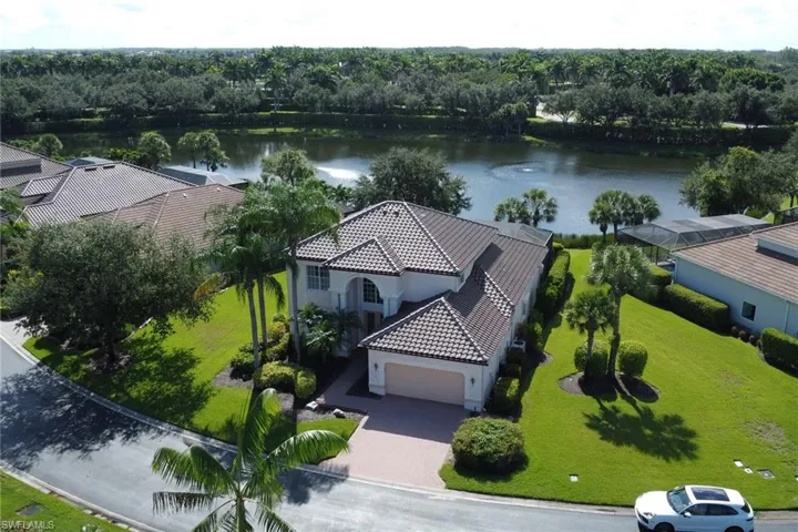 Drone / aerial view with a water view and a large lot.