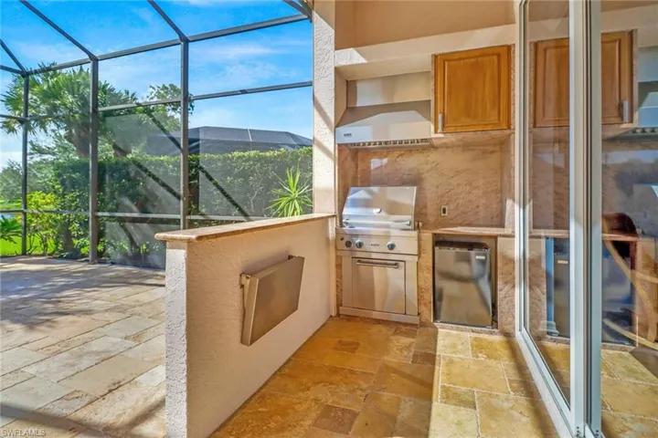 View of patio featuring an outdoor kitchen for grilling pleasure.