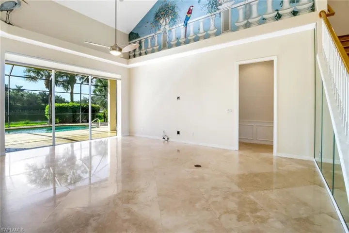 Great Room featuring high vaulted ceiling, ceiling fan and a painted mural.