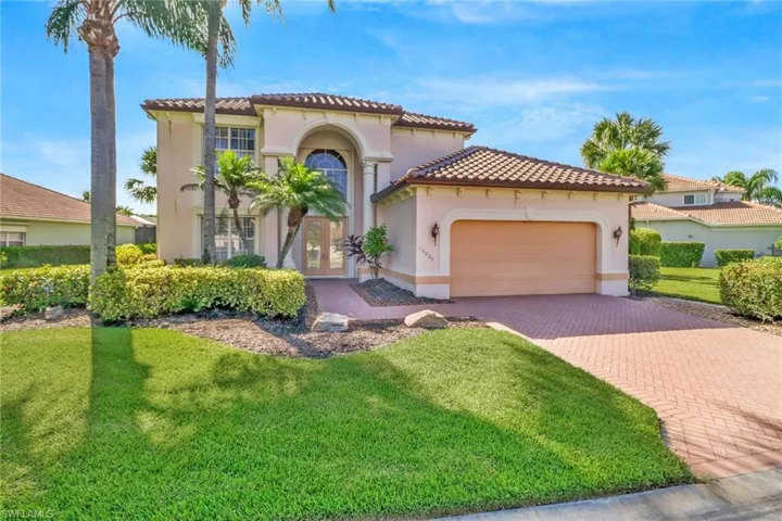 Two-Story House with a front lawn and a 2-car garage. Brand new Roof.