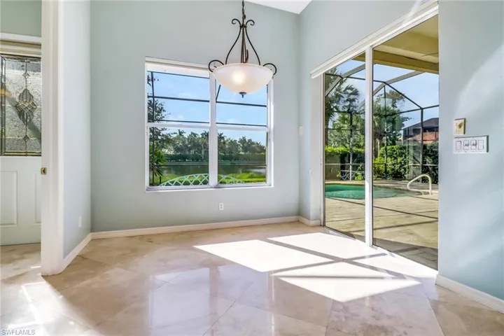 Breakfast room overlooking the lanai and pool area.