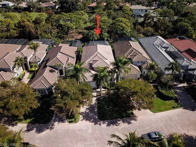 Aerial view of property's location featuring nearby suburban area