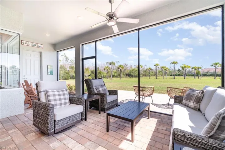 Large screened in lanai with outdoor patio.
