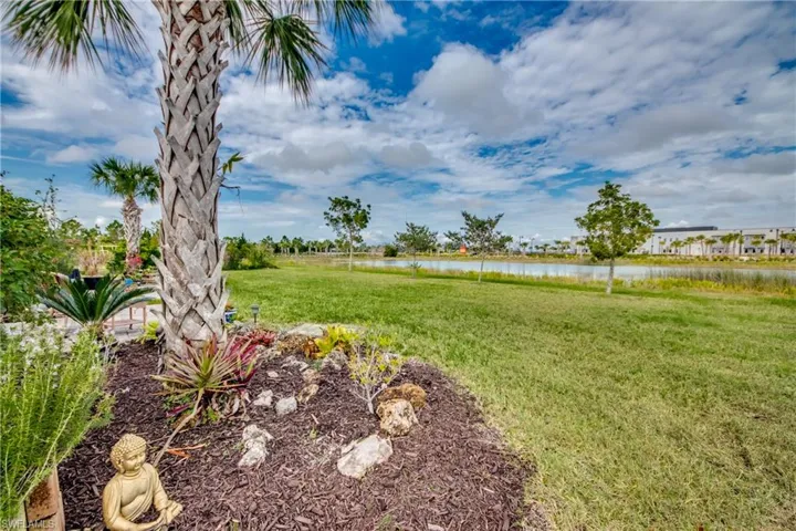 View of yard with a water view