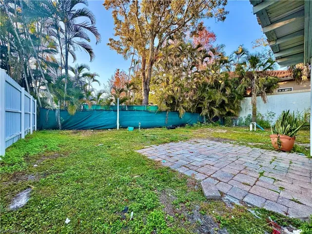 Fenced backyard featuring a patio area