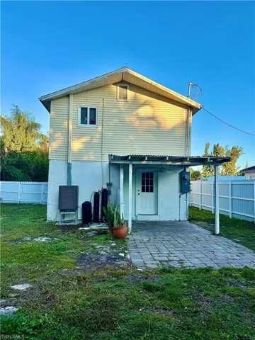 Rear view of property with a patio and stucco siding