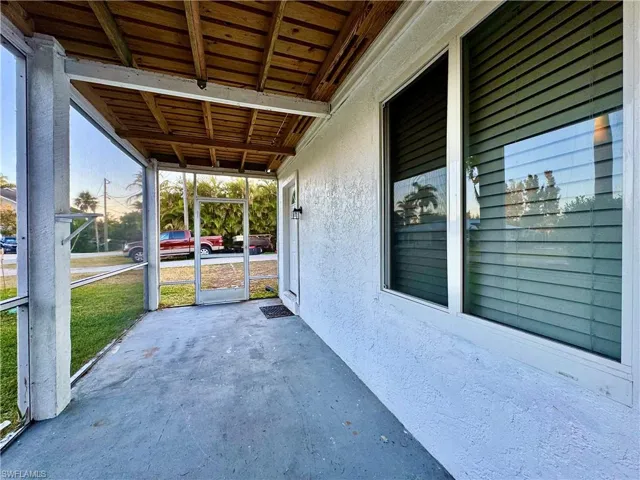 View of patio / terrace featuring a sunroom