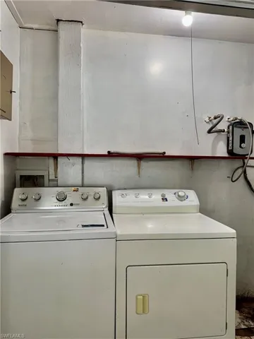 Laundry room featuring washing machine and clothes dryer