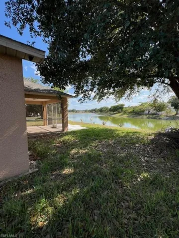 View of yard with a water view