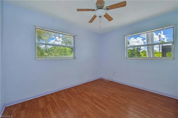 Wood-finish flooring with light blue walls
