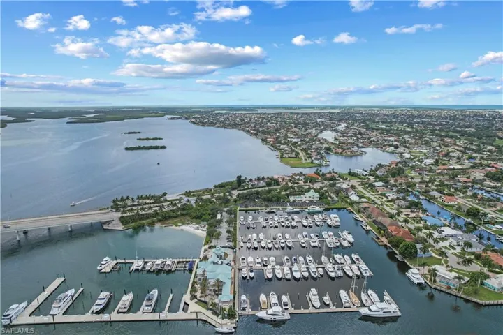 Yacht Club building under renovation (front of photo). Pool and Marina Club House (rear of photo)
