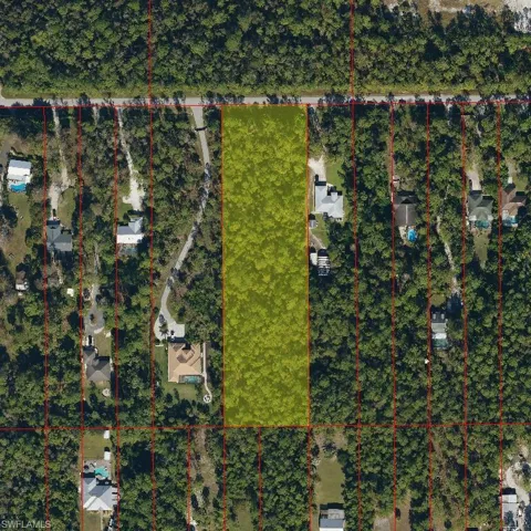 Aerial map of property and surrounding area featuring property boundaries highlighted