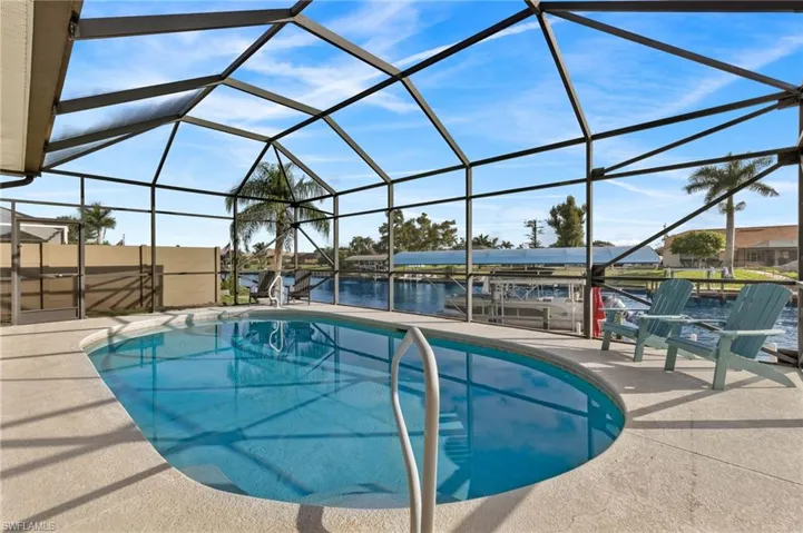 Another view of the pool and lanai overlooking the canal