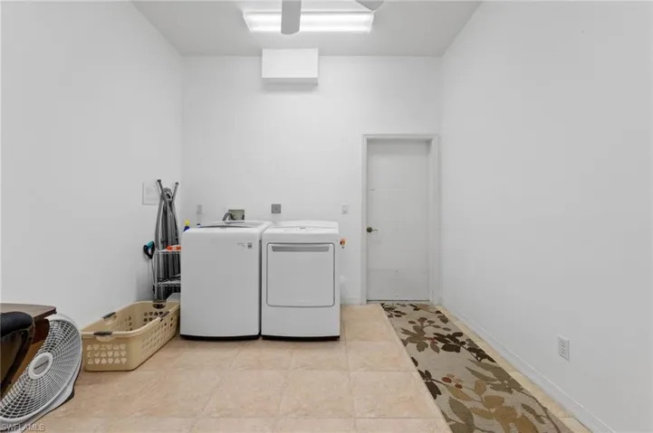 Laundry room with washing machine and dryer