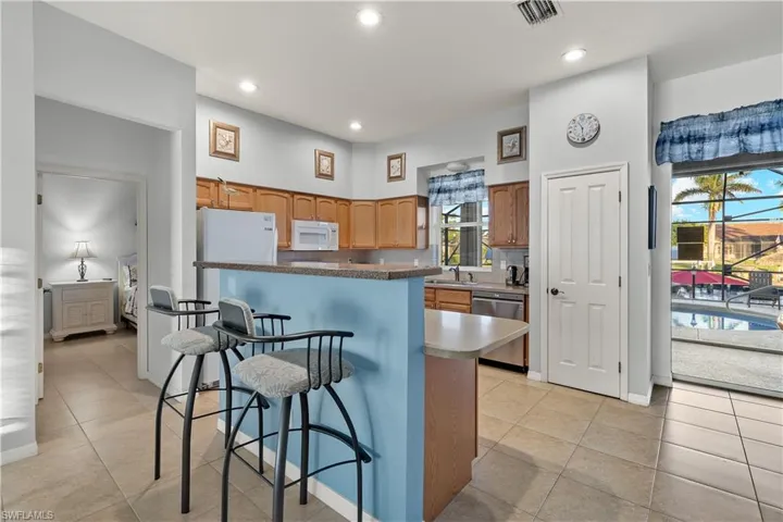 Solid surface counters, pantry, breakfast bar