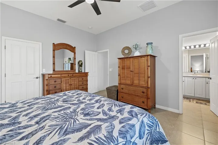 Tiled bedroom with large walk in closet