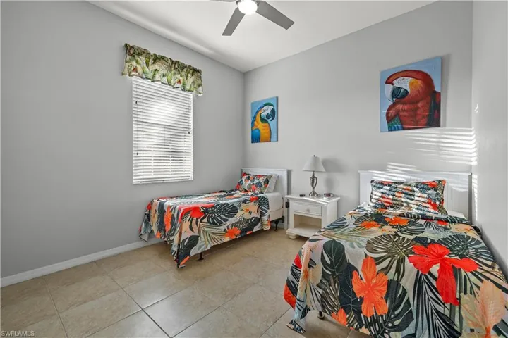 with 2 twin beds, TV and ceiling fan