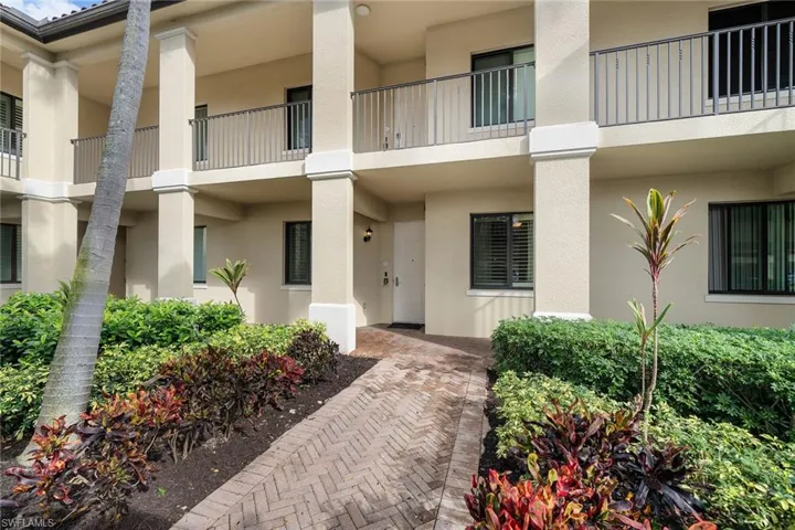 Property entrance featuring stucco siding