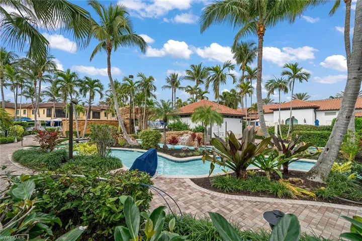 Community pool with a patio