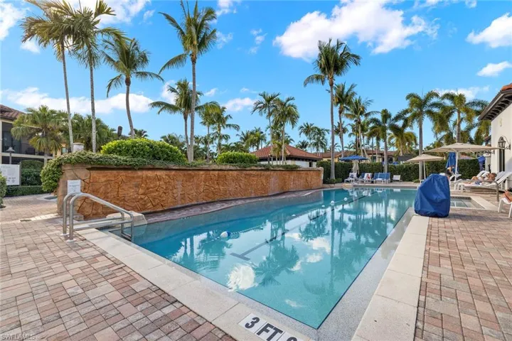 Community pool featuring a patio area and grilling area