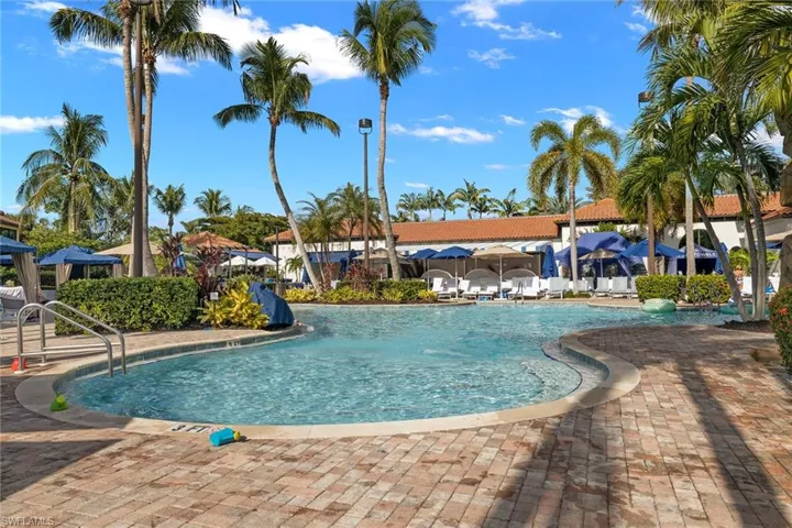 Community pool featuring a patio
