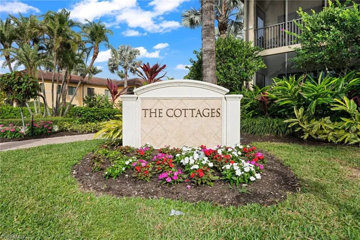 Community sign featuring a lawn