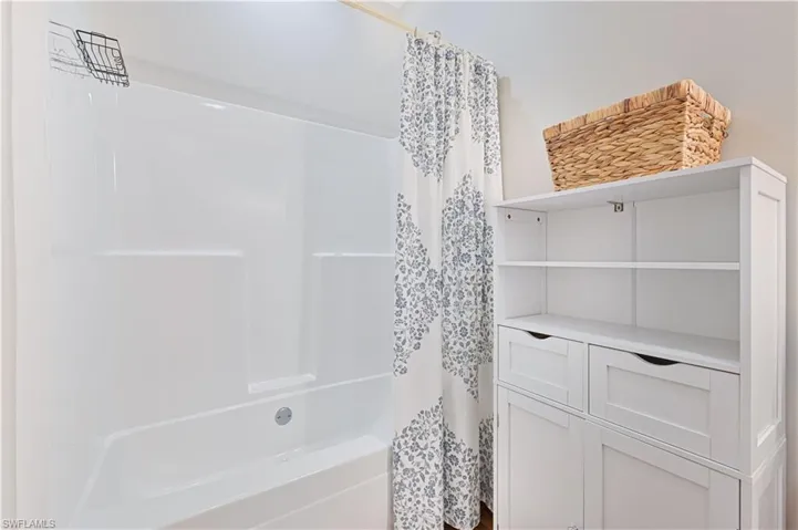 Bathroom featuring shower / bath combo with shower curtain