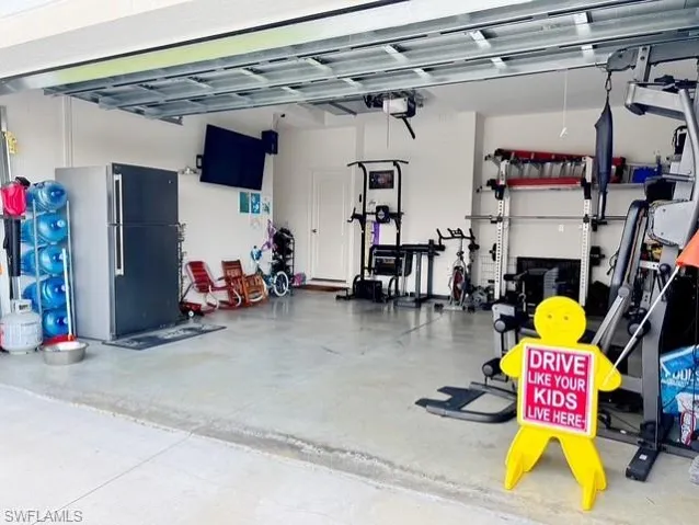 Garage with freestanding refrigerator